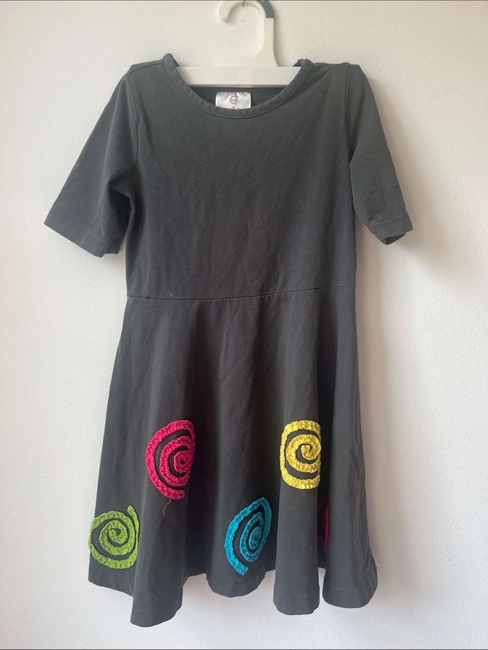 Hanna Andersson dress with rainbow swirl embellishments